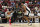 LAS VEGAS, NEVADA - JULY 13: Stephon Castle #5 of the San Antonio Spurs drives past Justin Minaya #24 of the Portland Trail Blazers in the second half of a 2024 NBA Summer League game at the Thomas & Mack Center on July 13, 2024 in Las Vegas, Nevada. The Spurs defeated the Trail Blazers 83-77. NOTE TO USER: User expressly acknowledges and agrees that, by downloading and or using this photograph, User is consenting to the terms and conditions of the Getty Images License Agreement. (Photo by Candice Ward/Getty Images)