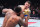 MANCHESTER, ENGLAND - JULY 27: (R-L) Tom Aspinall of England drops Curtis Blaydes with a punch in the interim UFC heavyweight championship bout during the UFC 304 event at Co-op Live on July 27, 2024 in Manchester, England.  (Photo by Chris Unger/Zuffa LLC via Getty Images)