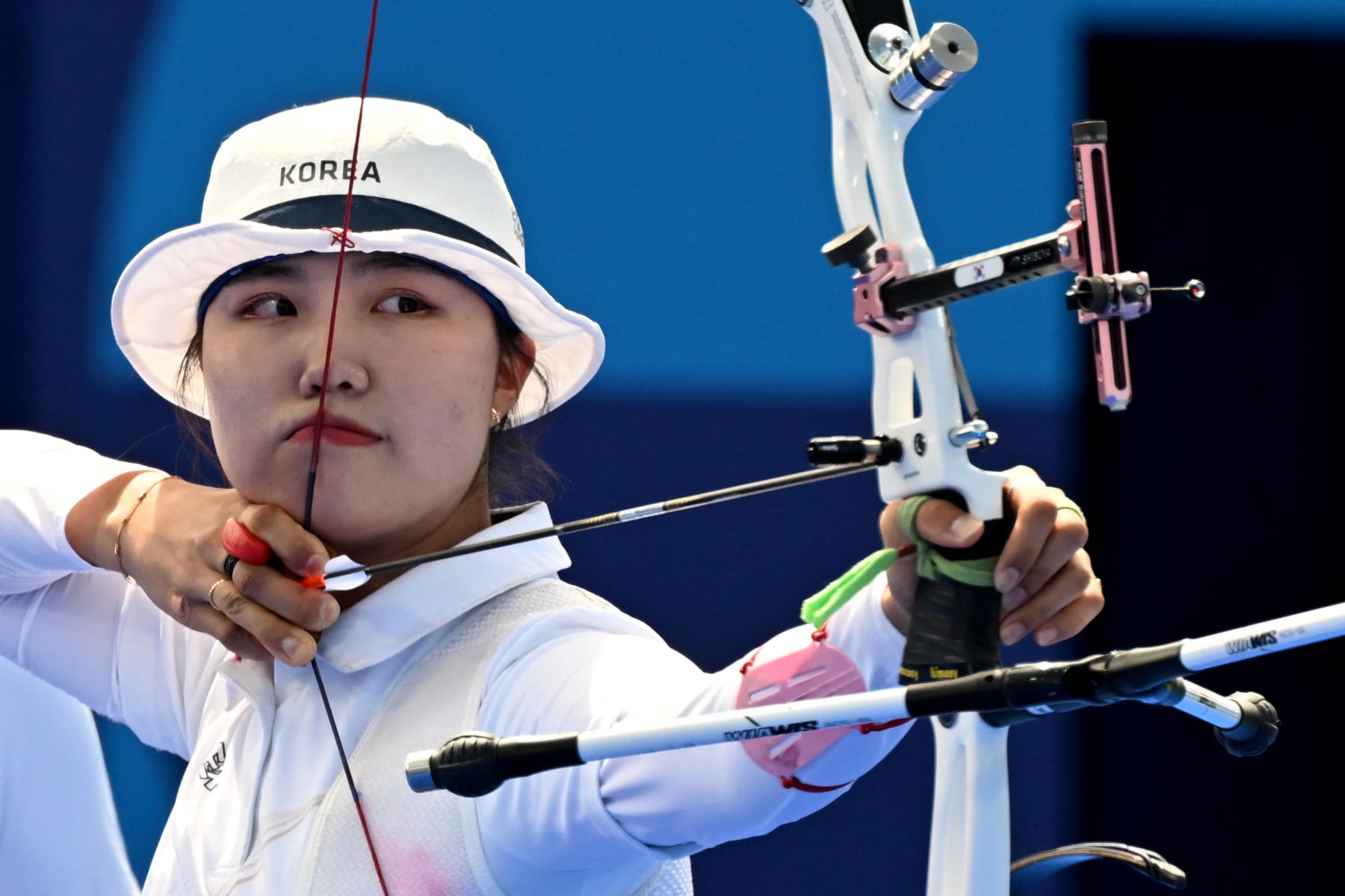 South Korea's Nam Suhyeon competes within the archery Ladies folks's crew quarterfinal through the Paris 2024 Olympic Games at the Esplanade des Invalides in Paris on July 28, 2024. (Photo by Punit PARANJPE / AFP) (Photo by PUNIT PARANJPE/AFP by plot of Getty Pictures)