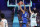 France's #27 Rudy Gobert dunks the ball past Japan's #34 Hugh Watanabe in the men's preliminary round group B basketball match between Japan and France during the Paris 2024 Olympic Games at the Pierre-Mauroy stadium in Villeneuve-d'Ascq, northern France, on July 30, 2024. (Photo by Thomas COEX / AFP) (Photo by THOMAS COEX/AFP via Getty Images)