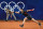 Britain's Andy Murray playing with Britain's Daniel Evans serves to US' Taylor Fritz and US' Tommy Paul during their men's doubles quarter-final tennis match on Court Suzanne-Lenglen at the Roland-Garros Stadium during the Paris 2024 Olympic Games, in Paris on August 1, 2024. (Photo by PATRICIA DE MELO MOREIRA / AFP) (Photo by PATRICIA DE MELO MOREIRA/AFP via Getty Images)