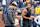 ANN ARBOR, MI - APRIL 02: Colin Kaepernick interacts with Michigan Wolverine head coach Jim Harbaugh during a throwing exhibition during half time of the Michigan spring football game at Michigan Stadium on April 2, 2022 in Ann Arbor, Michigan.  (Photo by Jaime Crawford/Getty Images)