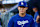 LOS ANGELES, CALIFORNIA - AUGUST 7: Yoshinobu Yamamoto #18 of the Los Angeles Dodgers walks through the dugout prior to a game against the Philadelphia Phillies at Dodger Stadium on August 7, 2024 in Los Angeles, California. (Photo by Brandon Sloter/Image Of Sport/Getty Images)