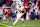 FAYETTEVILLE, ARKANSAS – NOVEMBER 11: Brian Battie #21 of the Auburn Tigers runs with the ball during the game against the Arkansas Razorbacks at Donald W. Reynolds Razorback Stadium on November 11, 2023 in Fayetteville, Arkansas. The Tigers defeated the Razorbacks 48-10. (Photo by Wesley Hitt/Getty Images)