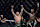Dricus Du Plessis of South Africa has his arm raised by Israel Adesanya of Nigeria.