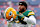 DENVER, COLORADO - AUGUST 18: Josh Jacobs #8 of the Green Bay Packers warms up against the Denver Broncos during a preseason game at Empower Field At Mile High on August 18, 2024 in Denver, Colorado. (Photo by Jamie Schwaberow/Getty Images)