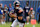 CHICAGO, IN - AUGUST 17: Caleb Williams #18 of the Chicago Bears drops the ball back to pass during the first quarter of an NFL preseason game against the Cincinnati Bengals, at Soldier Field on August 17, 2024 in Chicago, Illinois. (Photo by Todd Rosenberg/Getty Images)