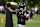 OWINGS MILLS, MD - AUGUST 12: Lamar Jackson #8 of the Baltimore Ravens attempts a pass during training camp at Under Armour Performance Center Baltimore Ravens on August 12, 2024 in Owings Mills, Maryland. (Photo by Scott Taetsch/Getty Images)