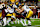 MINNEAPOLIS, MN - NOVEMBER 19: Mohamed Ibrahim #24 of the Minnesota Golden Gophers is tackled by Jack Campbell #31 and Seth Benson #44 of the Iowa Hawkeyes in the third quarter of the game at Huntington Bank Stadium on November 19, 2022 in Minneapolis, Minnesota. The Hawkeyes defeated the Golden Gophers 13-10. (Photo by David Berding/Getty Images)