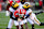 COLLEGE PARK, MARYLAND - NOVEMBER 18: Tai Felton #10 of the Maryland Terrapins is tackled by Makari Paige #7 and Will Johnson #2 of the Michigan Wolverines at SECU Stadium on November 18, 2023 in College Park, Maryland. (Photo by G Fiume/Getty Images)