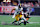 ATLANTA, GEORGIA - SEPTEMBER 08: Justin Fields #2 of the Pittsburgh Steelers avoids a tackle by Kaden Elliss #55 of the Atlanta Falcons during the fourth quarter at Mercedes-Benz Stadium on September 08, 2024 in Atlanta, Georgia. (Photo by Todd Kirkland/Getty Images)