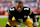 DENVER, CO - SEPTEMBER 15: Quarterback Russell Wilson #3 of the Pittsburgh Steelers stretches prior to an NFL football game against the Denver Broncos, at Empower Field at Mile High on September 15, 2024 in Denver, Colorado. (Photo by Brooke Sutton/Getty Images)