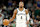 MILWAUKEE, WISCONSIN - MARCH 21: Dennis Smith Jr. #4 of the Brooklyn Nets dribbles onto the court during the second half of the game against the Milwaukee Bucks at Fiserv Forum on March 21, 2024 in Milwaukee, Wisconsin. NOTE TO USER: User expressly acknowledges and agrees that by downloading and/or using this photo, User agrees to the terms and conditions of the Getty Images License Agreement. (Photo by John Fisher/Getty Images)