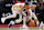 ATLANTA, GEORGIA - FEBRUARY 03: Lester Quinones #25 of the Golden State Warriors fouls while stealing the ball from Dejounte Murray #5 of the Atlanta Hawks during overtime at State Farm Arena on February 3, 2024 in Atlanta, Georgia. NOTE TO USER: User expressly acknowledges and agrees that by downloading and/or using this photo, user agrees to the terms and conditions of the Getty Images License Agreement. (Photo by Kevin C. Cox/Getty Images)