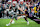 KANSAS CITY, KS – SEPTEMBER 13: UNLV quarterback Matthew Sluka (3) fights past the tackle of Kansas linebacker Cornell Wheeler (44) during the game between the Kansas Jayhawks and the UNLV Rebels on Friday, September 13, 2024 at Children's Mercy Park in Kansas City, Kansas. (Photo by Nick Tre. Smith/Icon Sportswire via Getty Images)