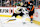 PHILADELPHIA, PENNSYLVANIA - APRIL 09: Jeremy Swayman #1 of the Boston Bruins attempts to play the puck behind his net against Tanner Laczynski #58 of the Philadelphia Flyers at the Wells Fargo Center on April 9, 2023 in Philadelphia, Pennsylvania. The Bruins went on to defeat the Flyers 5-3. The win was the Bruins' 63rd of the season, which is a new NHL record for wins in a single regular season. (Photo by Len Redkoles/NHLI via Getty Images)