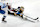 Boston, MA - January 18: Boston Bruins goalie Jeremy Swayman reaches out with his stick to clear the puck. The Bruins beat the Colorado Avalanche, 5-2. (Photo by John Tlumacki/The Boston Globe via Getty Images)