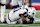 EAST RUTHERFORD, NEW JERSEY - SEPTEMBER 26: Micah Parsons #11 of the Dallas Cowboys reacts on the ground after playing the fourth quarter against the New York Giants at MetLife Stadium on September 26, 2024 in East Rutherford, New Jersey. (Photo by Luke Hales/Getty Images)