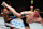 Thompson kicks Kevin Holland in a welterweight fight in 2022.