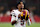 GLENDALE, ARIZONA - SEPTEMBER 29: Jayden Daniels #5 of the Washington Commanders looks on during the second half against the Arizona Cardinals at State Farm Stadium on September 29, 2024 in Glendale, Arizona. (Photo by Christian Petersen/Getty Images)
