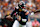 CHICAGO, ILLINOIS - SEPTEMBER 29: Caleb Williams #18 of the Chicago Bears rolls out to throw a pass under pressure during the first half against the Los Angeles Rams at Soldier Field on September 29, 2024 in Chicago, Illinois. (Photo by Brandon Sloter/Getty Images)