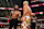 ATLANTA, GEORGIA - OCTOBER 5: Roman Reigns gives Cody Rhodes his title during Bad Blood at State Farm Arena on October 5, 2024 in Atlanta, Georgia. (Photo by WWE/Getty Images)