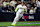 SAN DIEGO, CALIFORNIA - OCTOBER 08: Manny Machado #13 of the San Diego Padres reaches first base for a single in the second inning against the Los Angeles Dodgers during Game Three of the Division Series at Petco Park on October 08, 2024 in San Diego, California. (Photo by Katelyn Mulcahy/Getty Images)