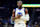 SAN FRANCISCO, CALIFORNIA - OCTOBER 13: Jonathan Kuminga #00 of the Golden State Warriors looks on against the Detroit Pistons during the first half of an NBA preseason game at Chase Center on October 13, 2024 in San Francisco, California. NOTE TO USER: User expressly acknowledges and agrees that, by downloading and or using this photograph, User is consenting to the terms and conditions of the Getty Images License Agreement. (Photo by Thearon W. Henderson/Getty Images)