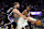 SAN FRANCISCO, CALIFORNIA - OCTOBER 11: Kevon Looney #5 of the Golden State Warriors is guarded by Domantas Sabonis #11 of the Sacramento Kings during the second half of their preseason game at Chase Center on October 11, 2024 in San Francisco, California. NOTE TO USER: User expressly acknowledges and agrees that, by downloading and/or using this photograph, user is consenting to the terms and conditions of the Getty Images License Agreement. (Photo by Ezra Shaw/Getty Images)