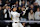 NEW YORK, NEW YORK - OCTOBER 15: Aaron Judge #99 of the New York Yankees watches as Brayan Rocchio #4 of the Cleveland Guardians makes a fielding error on his hit in the first inning during Game Two of the American League Championship Series at Yankee Stadium on October 15, 2024 in New York City. (Photo by Elsa/Getty Images)