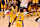 Los Angeles Lakers' US guard #09 Bronny James  jumps to block a shot as Los Angeles Lakers' US small forward #23 LeBron James looks on during the NBA game season opener between the Los Angeles Lakers and the Minnesota Timberwolves at Crypto Arena in Los Angeles on October 22, 2024. LeBron and Bronny are the first father and son to play together in any NBA game. (Photo by Frederic J. Brown / AFP) (Photo by FREDERIC J. BROWN/AFP via Getty Images)