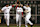 BOSTON - OCTOBER 24: With the final score visible behind them, Boston Red Sox outfielders Gabe Kapler, Johnny Damon, and Trot Nixon celebrate the Game Two victory.(Photo by Jim Davis/The Boston Globe via Getty Images)