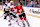 INGLEWOOD, CA - 1989: Left wing Al Secord #20 of the Chicago Blackhawks (sans helmet) checks his opponent during a game against the Los Angeles Kings at the Great Western Forum during the 1989-90 season in Inglewood, California. (Photo by Mike Powell/Getty Images)