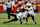 AMES, IA - 02 NOVEMBER: Pemain belakang Jaylon Jackson #12 dari Iowa State Cyclones ditangani oleh gelandang Ben Roberts #13, dan bek bertahan Brenden Jordan #7 dari Texas Tech Red Raiders saat ia berlari sejauh yard di paruh pertama bermain di Stadion Jack Trice pada 2 November 2024, di Ames, Iowa. (Foto oleh David Purdy/Getty Images)