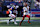 EAST RUTHERFORD, NEW JERSEY - NOVEMBER 3: Jayden Daniels #5 of the Washington Commanders is chased by Micah McFadden #41 of the New York Giants during the first half at MetLife Stadium on November 03, 2024 in East Rutherford, New Jersey. (Photo by Al Bello/Getty Images)