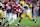 TUSCALOOSA, ALABAMA - NOVEMBER 04: Jalen Milroe #4 of the Alabama Crimson Tide rushes away from Jacobian Guillory #90 of the LSU Tigers during the fourth quarter at Bryant-Denny Stadium on November 04, 2023 in Tuscaloosa, Alabama. (Photo by Kevin C. Cox/Getty Images)
