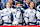 WINNIPEG, CANADA - NOVEMBER 3: Mitchell Chaffee #41, Brayden Point #21 and Luke Glendening #11 of the Tampa Bay Lightning stand on the bench during the singing of the National anthems prior to puck drop against the Winnipeg Jets at the Canada Life Centre on November 3, 2024 in Winnipeg, Manitoba, Canada. (Photo by Jonathan Kozub/NHLI via Getty Images)