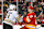 CALGARY, CANADA - FEBRUARY 22: Yegor Sharangovich #17 of the Calgary Flames shoves Trent Frederic #11 of the Boston Bruins after the whistle during the third period of an NHL game at Scotiabank Saddledome on February 22, 2024 in Calgary, Alberta, Canada. The Flames defeated the Bruins 3-2 in overtime. (Photo by Derek Leung/Getty Images)