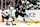 BOSTON, MA - DECEMBER 19: Boston Bruins center Trent Frederic (11) watched by Minnesota Wild right wing Matt Boldy (12) during a game between the Boston Bruins and the Minnesota Wild on December 19, 2023, at TD Garden in Boston, Massachusetts. (Photo by Fred Kfoury III/Icon Sportswire via Getty Images)