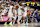 AUBURN, ALABAMA - NOVEMBER 6: Teammates celebrate with Miles Kelly #13 of the Auburn Tigers during the second half against the Vermont Catamounts at Neville Arena on November 6, 2024 in Auburn, Alabama. (Photo by Stew Milne/Getty Images)