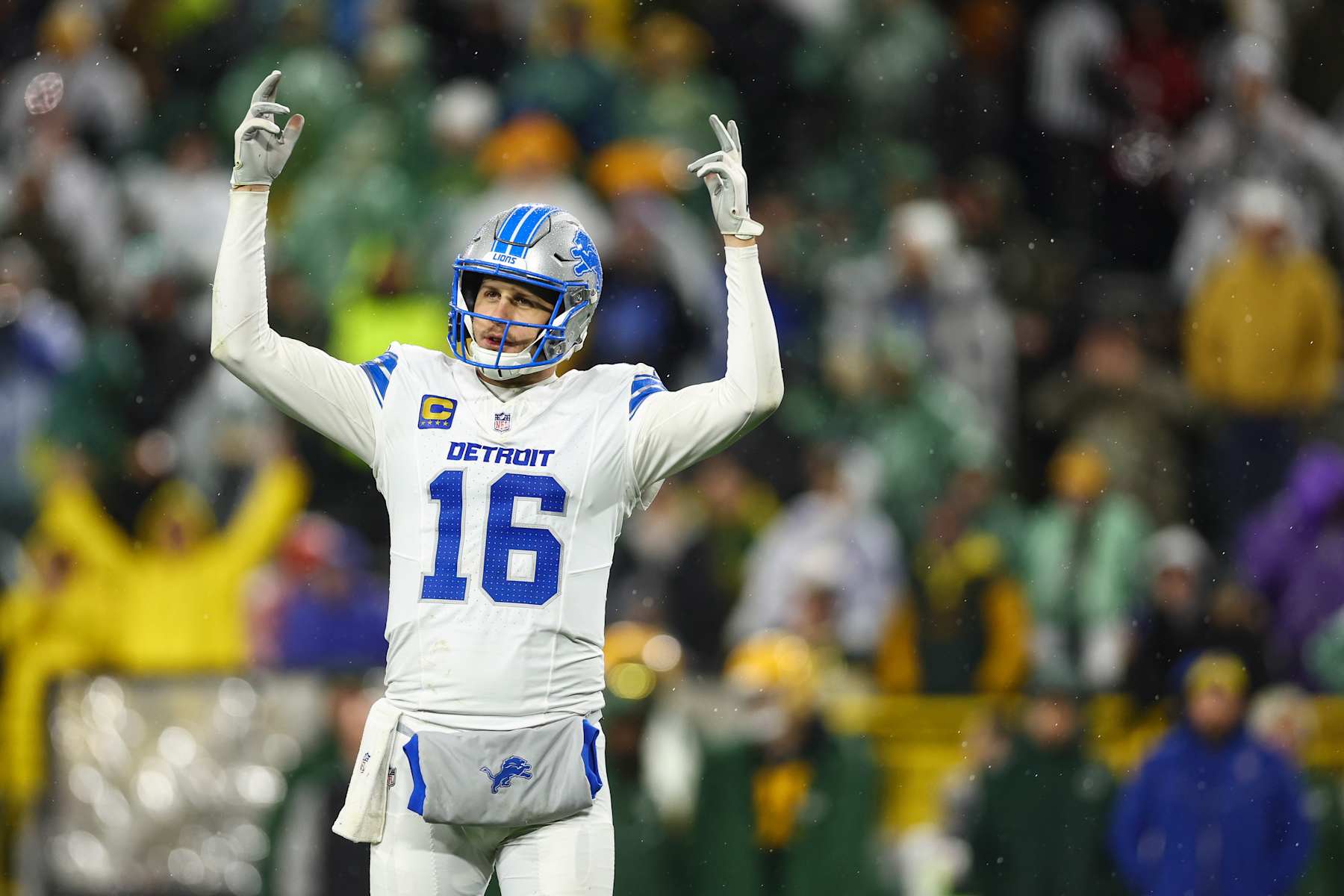 GREEN BAY, WISCONSIN - NOVEMBER 3: Jared Goff #16 of the Detroit Lions pumps up the crowd in celebration after a play during an NFL football game against the Green Bay Packers at Lambeau Field on November 3, 2024 in Green Bay, WI. (Photo by Kevin Sabitus/Getty Images)
