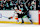 Seattle Kraken forward Brandon Tanev (right) checks Anaheim Ducks forward Trevor Zegras.