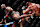 Jon Jones lands a spinning back kick against Stipe Miocic
