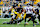 PITTSBURGH, PENNSYLVANIA - NOVEMBER 17: Justin Fields #2 of the Pittsburgh Steelers runs past Odafe Oweh #99 of the Baltimore Ravens in the third quarter of a game at Acrisure Stadium on November 17, 2024 in Pittsburgh, Pennsylvania. (Photo by Justin K. Aller/Getty Images)