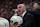 RALEIGH, NC - OCTOBER 31: Boston Bruins head coach Jim Montgomery calls to the officials during the NHL game between the Boston Bruins and the Carolina Hurricanes on October 31, 2024 at Lenovo Center in Raleigh, North Carolina. (Photo by Katherine Gawlik/Icon Sportswire via Getty Images)