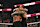 ATLANTA, GEORGIA - OCTOBER 5: Roman Reigns and Jimmy Uso embrace during Bad Blood at State Farm Arena on October 5, 2024 in Atlanta, Georgia. (Photo by WWE/Getty Images)