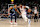 MEMPHIS, TENNESSEE - NOVEMBER 20: Paul George #8 of the Philadelphia 76ers drives to the basket against Desmond Bane #22 of the Memphis Grizzlies during the first half at FedExForum on November 20, 2024 in Memphis, Tennessee. NOTE TO USER: User expressly acknowledges and agrees that, by downloading and or using this photograph, User is consenting to the terms and conditions of the Getty Images License Agreement. (Photo by Justin Ford/Getty Images)