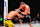 MACAU, CHINA - NOVEMBER 23: (R-L) Petr Yan of Russia knees Deiveson Figueiredo of Brazil in their bantamweight fight during the UFC Fight Night event at Galaxy Arena on November 23, 2024 in Macau, China. (Photo by Jeff Bottari/Zuffa LLC)
