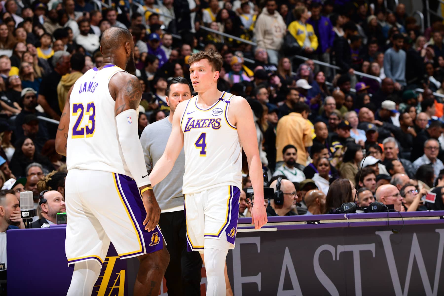 LOS ANGELES, CA - NOVEMBER 23: LeBron James #23 and Dalton Knecht #4 of the Los Angeles Lakers look on during the game against the Denver Nuggets on November 23, 2024 at Crypto.Com Arena in Los Angeles, California. NOTE TO USER: User expressly acknowledges and agrees that, by downloading and/or using this Photograph, user is consenting to the terms and conditions of the Getty Images License Agreement. Mandatory Copyright Notice: Copyright 2024 NBAE (Photo by Adam Pantozzi/NBAE via Getty Images)