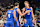 ORLANDO, FLORIDA - NOVEMBER 12: Moritz Wagner #21 of the Orlando Magic reacts with Franz Wagner #22 and Jalen Suggs #4 of the Orlando Magic after a foul in the first half against the Charlotte Hornets during an Emirates NBA Cup game at Kia Center on November 12, 2024 in Orlando, Florida. NOTE TO USER: User expressly acknowledges and agrees that, by downloading and or using this photograph, User is consenting to the terms and conditions of the Getty Images License Agreement. (Photo by Julio Aguilar/Getty Images)